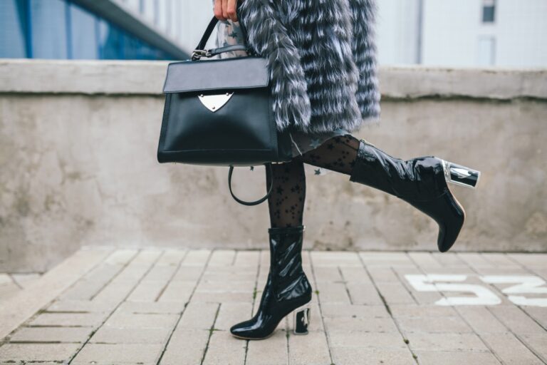Close Up Accessories Details Stylish Woman Walking City Warm Fur Coat Winter Season Cold Weather Holding Leather Handbag Legs Boots Footwear Street Fashion Trend 1 768x512