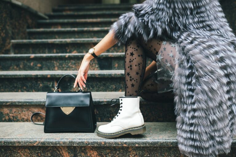 Close Up Legs White Boots Fashionable Woman Posing City Warm Fur Coat With Black Leather Bag 1 768x512